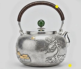 Fine silver teapot with traditional landscape relief £5450 order number 854.