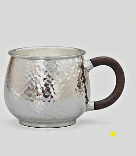 Fine sterling hammered silver mug with dark wood handle £1800 order number 880