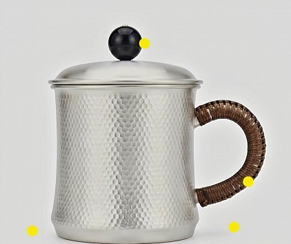 Sterling Hammered silver mug with wicker wrapped handle £5008 order number 088