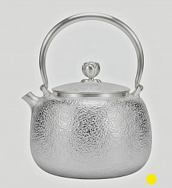Fine hammered silver teapot with elegant finial and attractive curved handle £5000 order number 088