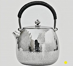 Hand-Hammered sterling silver teapot with black wrapped handle £5500 order number 880