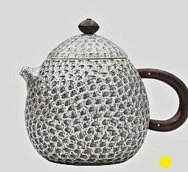 Hammered sterling silver teapot with dark wood handle £1500 order number 588